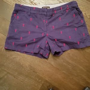 Navy shorts with red embroidered lobsters.